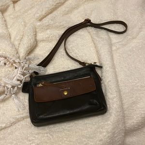 100% leather. Brown and black satchel.